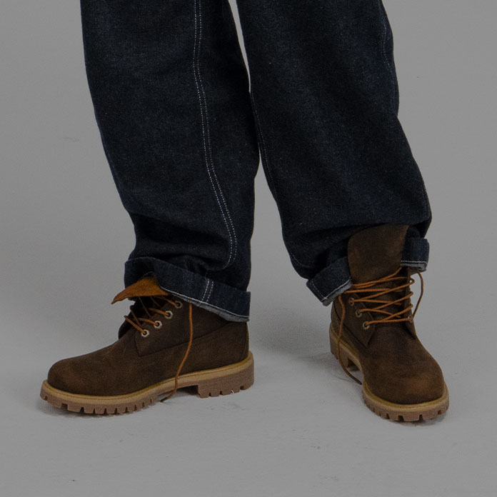 Timberland Holiday Gift Guide image of a man wearing brown Timberland boots and baggy jeans