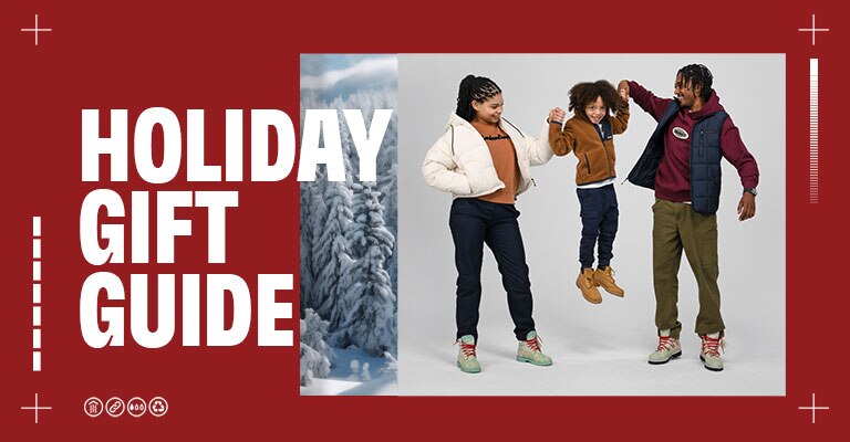 Timberland Holiday Gift Guide Hero Image with two adults and a child all wearing Timberland clothing and boots
